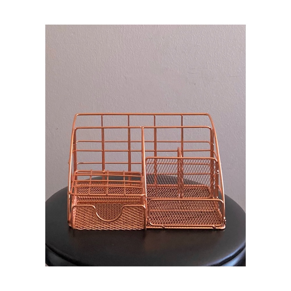 rose gold colored metal desktop organizer